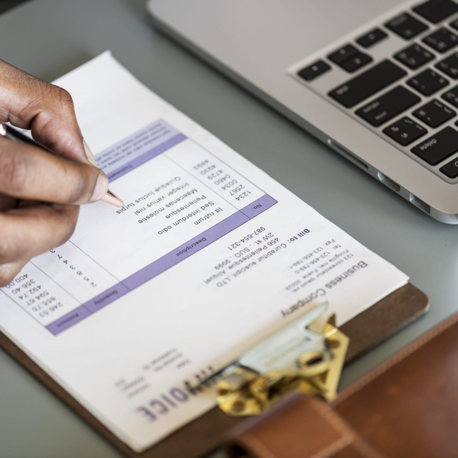 Closeup of business man checking tax invoice paper Closeup of business man checking tax invoice paper